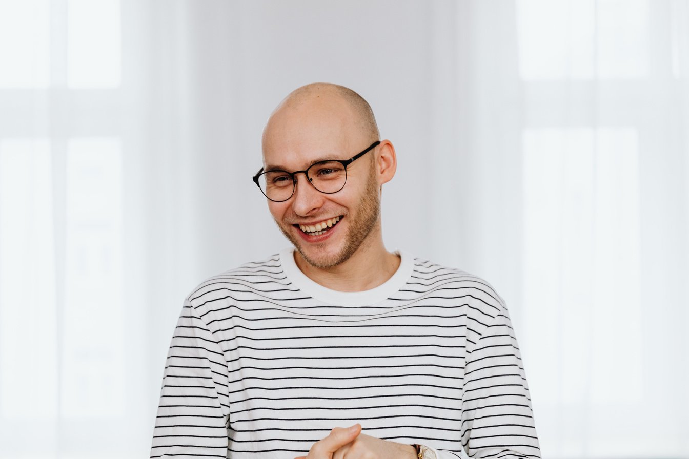 Man with Black Framed Eyeglasses Smiling